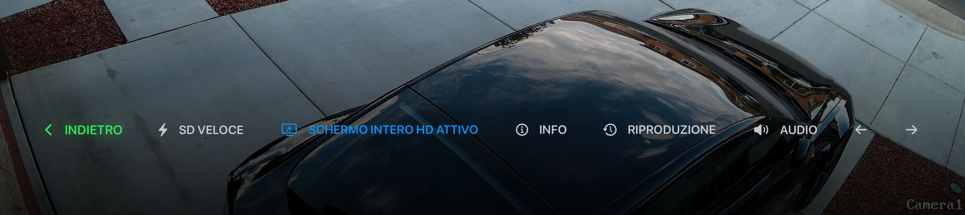 La barra dei controlli della visualizzazione live: Indietro, SD veloce, Schermo intero HD, Info, Riproduzione, audio e frecce per la telecamera precedente e successiva.